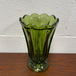 Lovely vintage green glass vase with a pretty scalloped edge and good height for flowers.