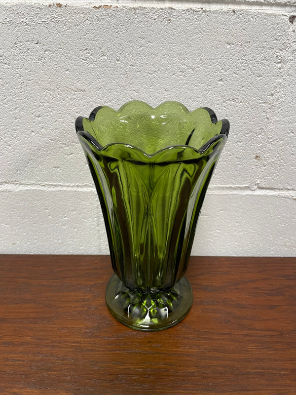 Lovely vintage green glass vase with a pretty scalloped edge and good height for flowers.