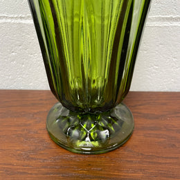 Lovely vintage green glass vase with a pretty scalloped edge and good height for flowers.