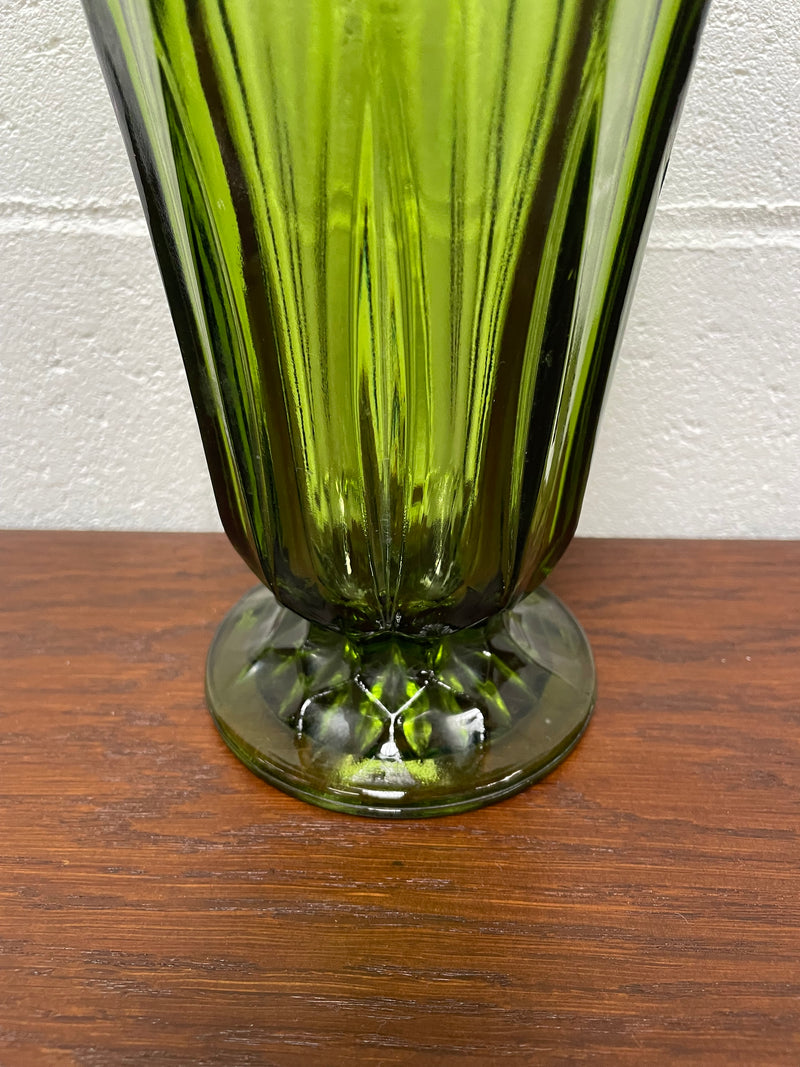 Lovely vintage green glass vase with a pretty scalloped edge and good height for flowers.