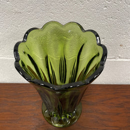 Lovely vintage green glass vase with a pretty scalloped edge and good height for flowers.