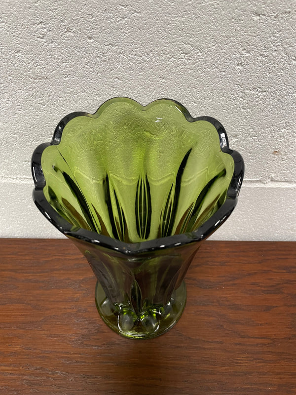 Lovely vintage green glass vase with a pretty scalloped edge and good height for flowers.