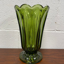 Lovely vintage green glass vase with a pretty scalloped edge and good height for flowers.