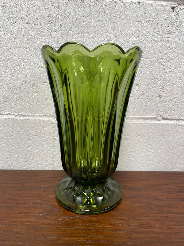 Lovely vintage green glass vase with a pretty scalloped edge and good height for flowers.