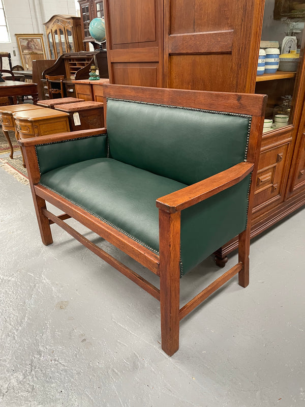 Rustic Arts and Crafts upholstered green bench seat. Made of English oak and very comfortable to sit on. In good original condition. Please see all photos as they form part of the description and condition.