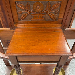 Lovely Edwardian walnut stand with six brass hooks and a storage box with lift up lid . Very nice carving to back and in good original condition. Please view photos as they help to form part of the description and condition.