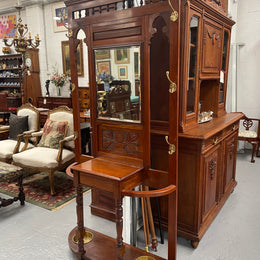 Lovely Edwardian walnut stand with six brass hooks and a storage box with lift up lid . Very nice carving to back and in good original condition. Please view photos as they help to form part of the description and condition.