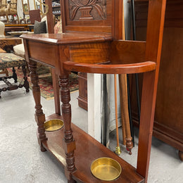 Lovely Edwardian walnut stand with six brass hooks and a storage box with lift up lid . Very nice carving to back and in good original condition. Please view photos as they help to form part of the description and condition.