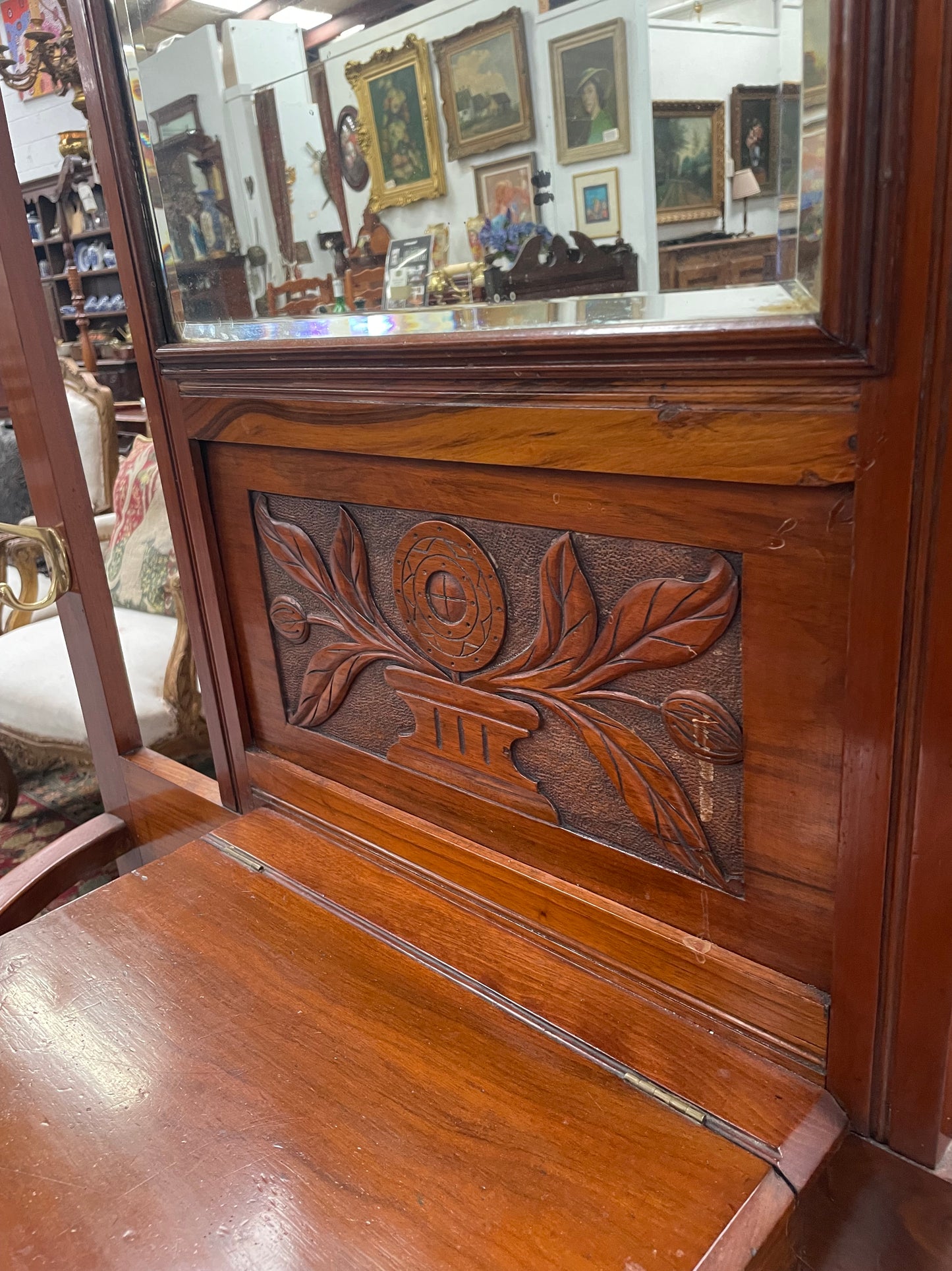 Lovely Edwardian walnut stand with six brass hooks and a storage box with lift up lid . Very nice carving to back and in good original condition. Please view photos as they help to form part of the description and condition.