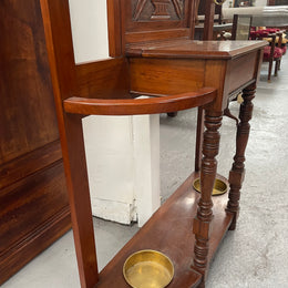 Lovely Edwardian walnut stand with six brass hooks and a storage box with lift up lid . Very nice carving to back and in good original condition. Please view photos as they help to form part of the description and condition.