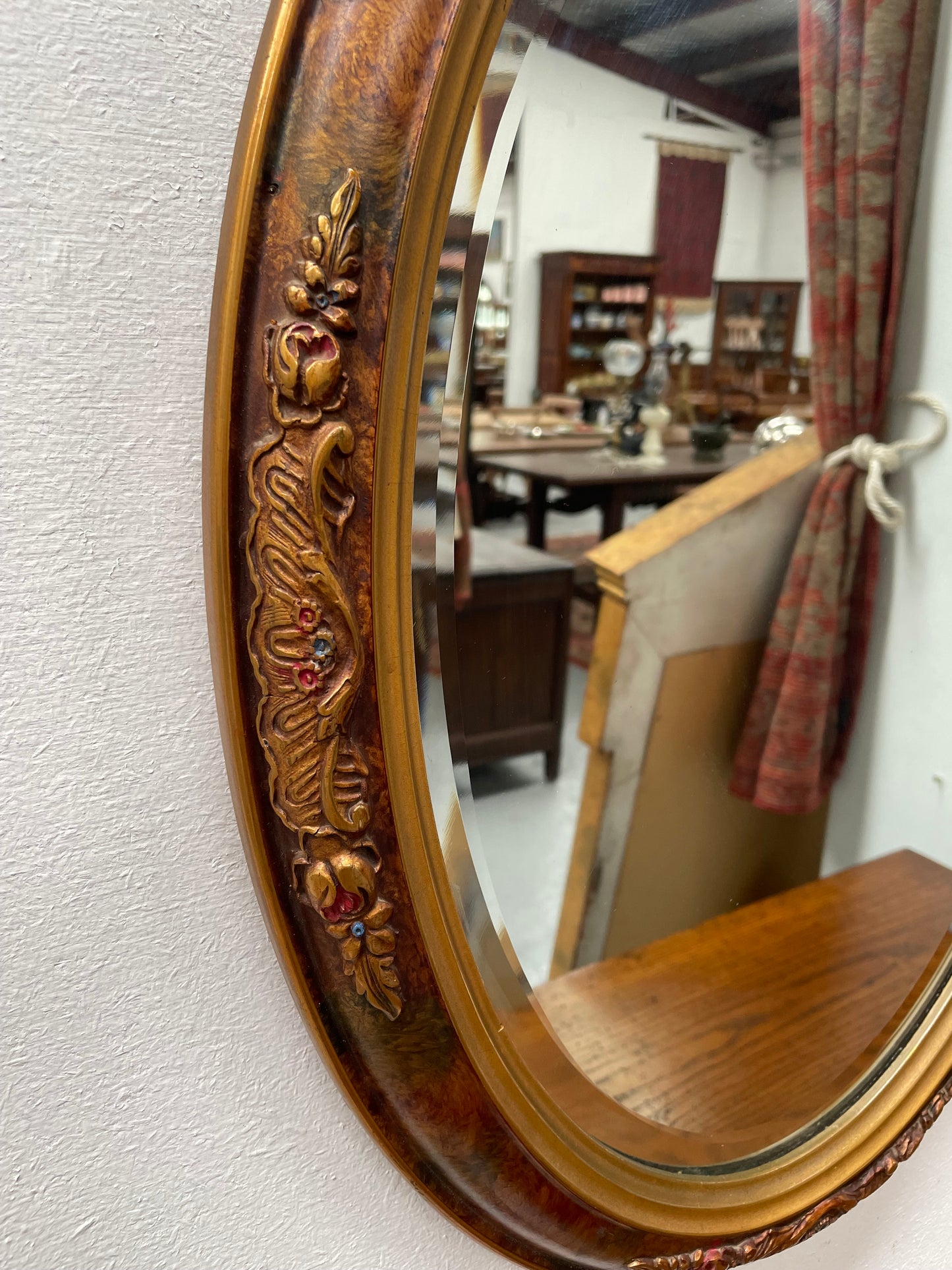 Lovely decorative vintage mirror with a pretty oval frame and bevelled edge mirror. Sourced locally and in good original condition. Please see photos as they form part of the description and condition.