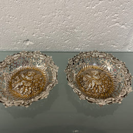 Lovely pair of sterling silver and silver gilt Edwardian bon bon dishes with decorative cherubs and in good original condition. Please see photos as they form part of the description.