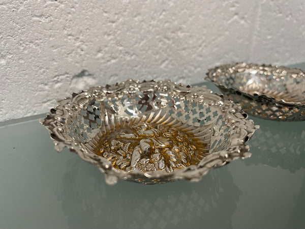 Lovely pair of sterling silver and silver gilt Edwardian bon bon dishes with decorative cherubs and in good original condition. Please see photos as they form part of the description.