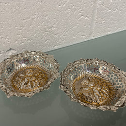 Lovely pair of sterling silver and silver gilt Edwardian bon bon dishes with decorative cherubs and in good original condition. Please see photos as they form part of the description.