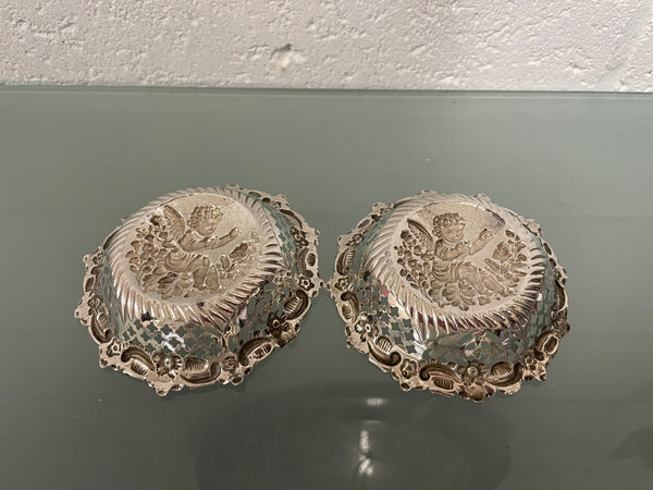 Lovely pair of sterling silver and silver gilt Edwardian bon bon dishes with decorative cherubs and in good original condition. Please see photos as they form part of the description.