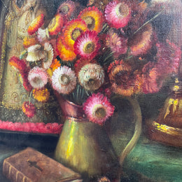 Beautiful French canvas painting of flowers and a bible framed in a lovely gold frame. It is in good original condition. 