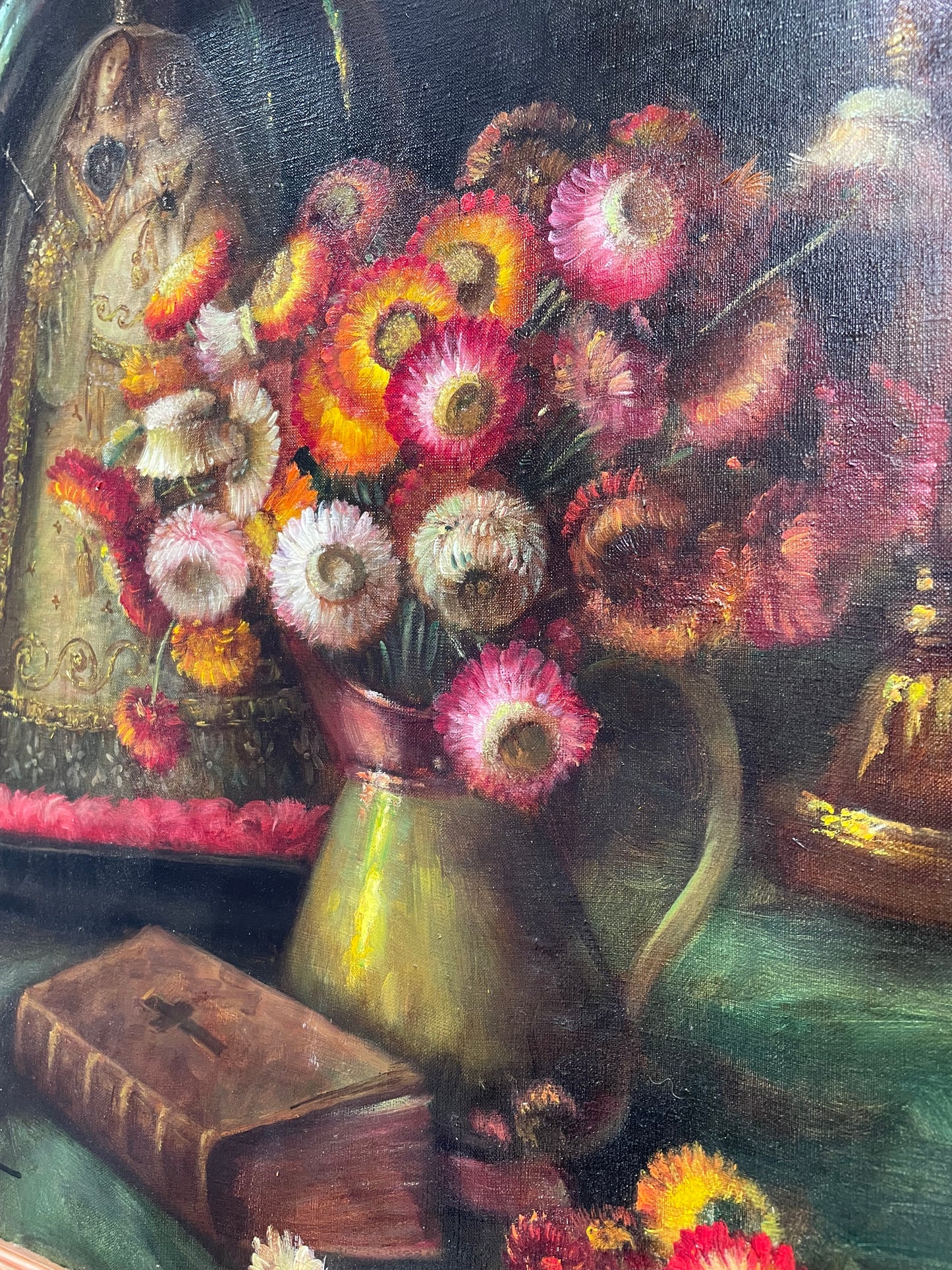 Beautiful French canvas painting of flowers and a bible framed in a lovely gold frame. It is in good original condition. 