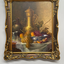 Beautiful oil on canvas on board painting of a bowl of fruit and jug on table, signed by Dutch artist. Framed in an ornate gilt frame and in good original condition.