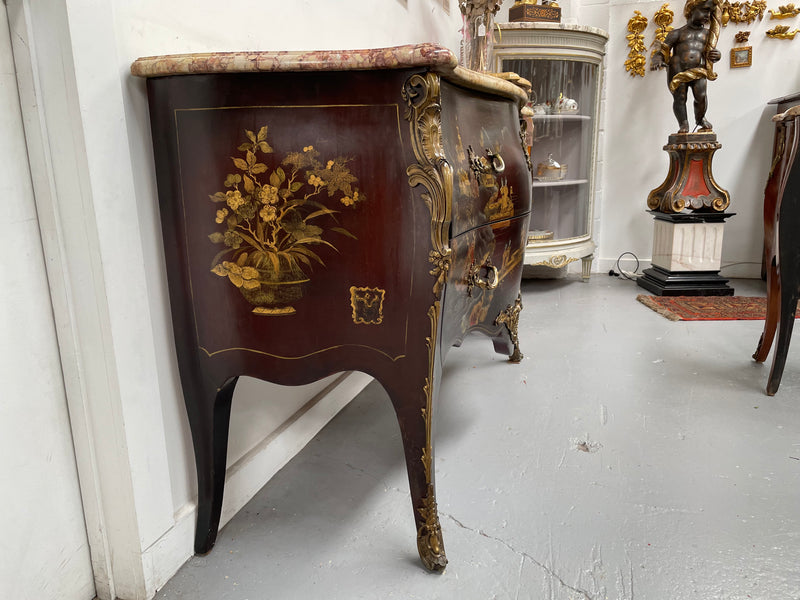 A stunning Antique Louis XV style Chinoiseries marble top two drawer commode with beautiful hand painted decorative details throughout. It has quality decorative ormolu mounts and handles. It is in good original detailed condition. 