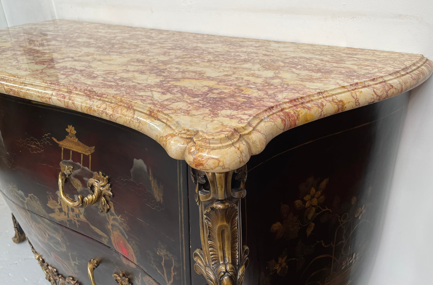 A stunning Antique Louis XV style Chinoiseries marble top two drawer commode with beautiful hand painted decorative details throughout. It has quality decorative ormolu mounts and handles. It is in good original detailed condition. 