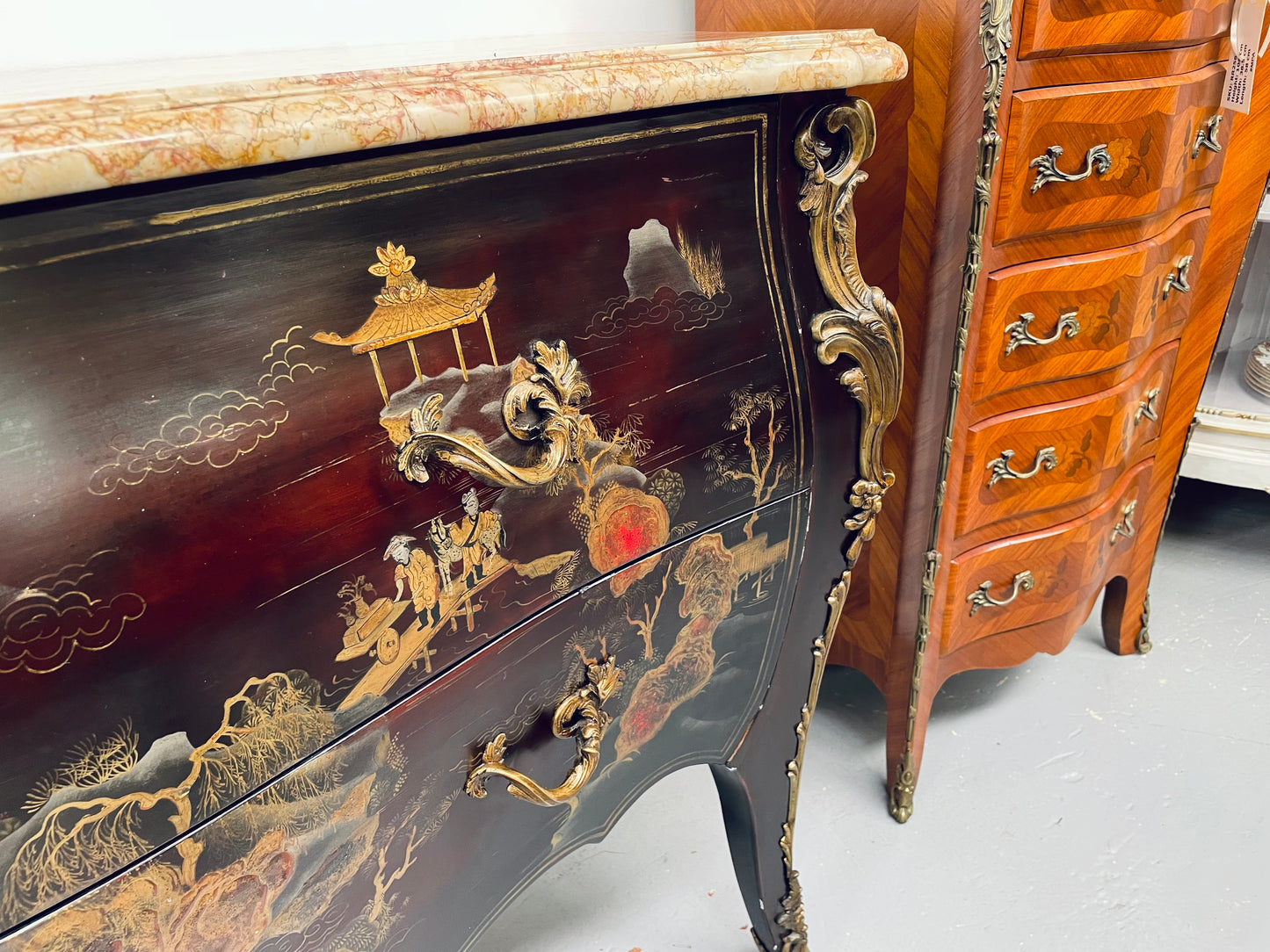 A stunning Antique Louis XV style Chinoiseries marble top two drawer commode with beautiful hand painted decorative details throughout. It has quality decorative ormolu mounts and handles. It is in good original detailed condition. 