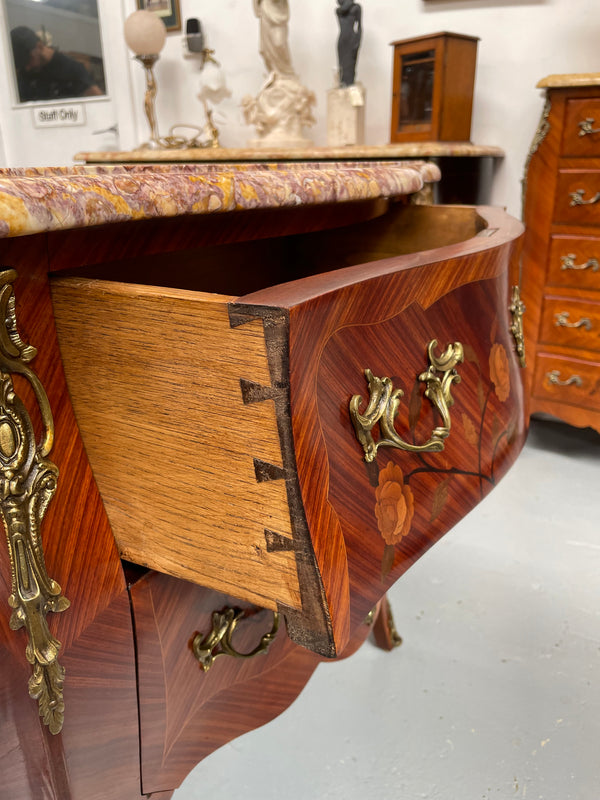 Beautiful French Louis XV style marquetry inlaid two drawer commode. It is of pleasing small proportions and a lovely coloured marble top. It is in good original detailed condition. Please see all photos as they form part of the description and condition.