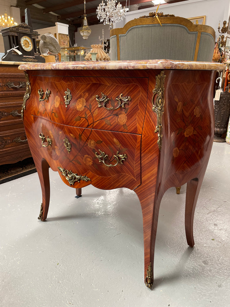 Beautiful French Louis XV style marquetry inlaid two drawer commode. It is of pleasing small proportions and a lovely coloured marble top. It is in good original detailed condition. Please see all photos as they form part of the description and condition.