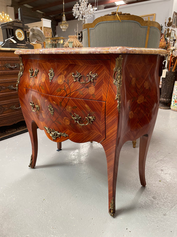 Beautiful French Louis XV style marquetry inlaid two drawer commode. It is of pleasing small proportions and a lovely coloured marble top. It is in good original detailed condition. Please see all photos as they form part of the description and condition.