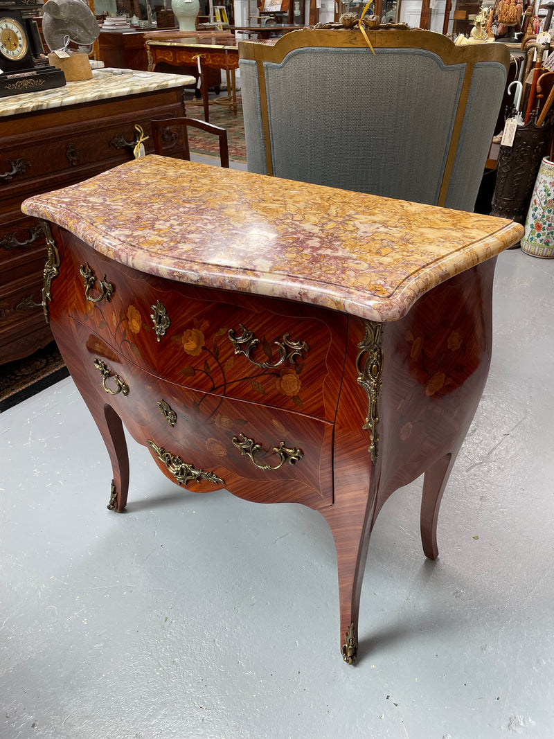 Beautiful French Louis XV style marquetry inlaid two drawer commode. It is of pleasing small proportions and a lovely coloured marble top. It is in good original detailed condition. Please see all photos as they form part of the description and condition.