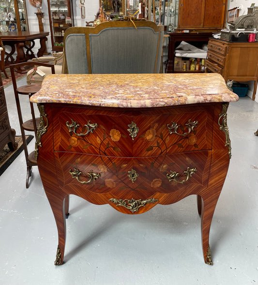 Beautiful French Louis XV style marquetry inlaid two drawer commode. It is of pleasing small proportions and a lovely coloured marble top. It is in good original detailed condition. Please see all photos as they form part of the description and condition.