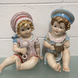 Pair of Vintage Piano Doll Figures