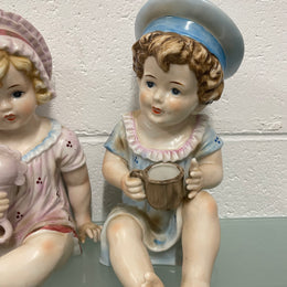 Pair of Vintage Piano Doll Figures