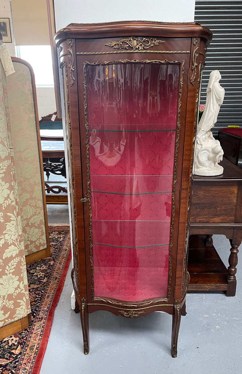 Beautiful French Louis XV style Walnut and bronze mounted vitrine with fabric interior and glass shelves. Sourced from France and in good original detailed condition.
