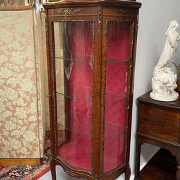 Beautiful French Louis XV style Walnut and bronze mounted vitrine with fabric interior and glass shelves. Sourced from France and in good original detailed condition.