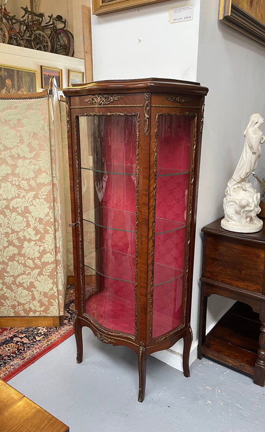 Beautiful French Louis XV style Walnut and bronze mounted vitrine with fabric interior and glass shelves. Sourced from France and in good original detailed condition.