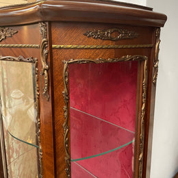Beautiful French Louis XV style Walnut and bronze mounted vitrine with fabric interior and glass shelves. Sourced from France and in good original detailed condition.