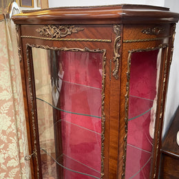 Beautiful French Louis XV style Walnut and bronze mounted vitrine with fabric interior and glass shelves. Sourced from France and in good original detailed condition.
