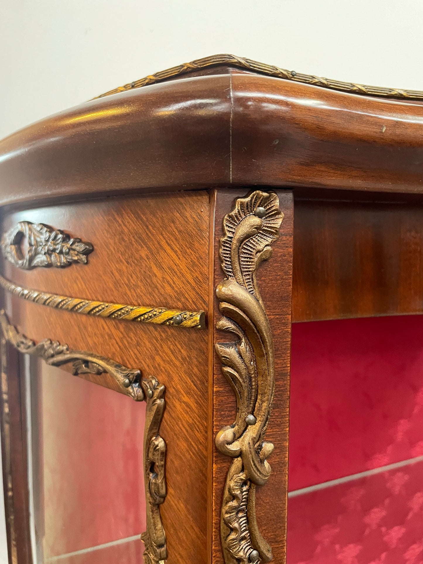 Beautiful French Louis XV style Walnut and bronze mounted vitrine with fabric interior and glass shelves. Sourced from France and in good original detailed condition.