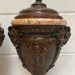 Pair of French Bronzed Spelter Urns on a Marble Base