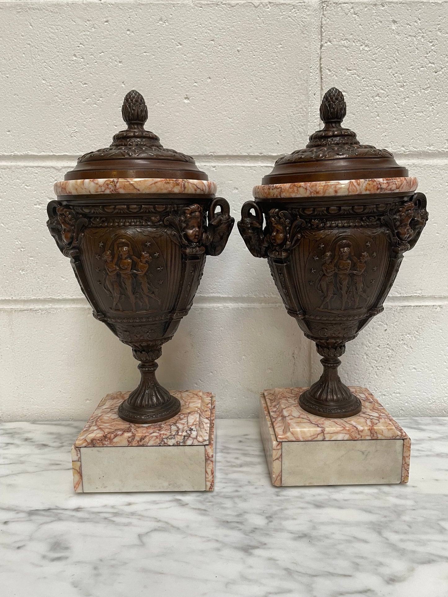 Pair of French Bronzed Spelter Urns on a Marble Base