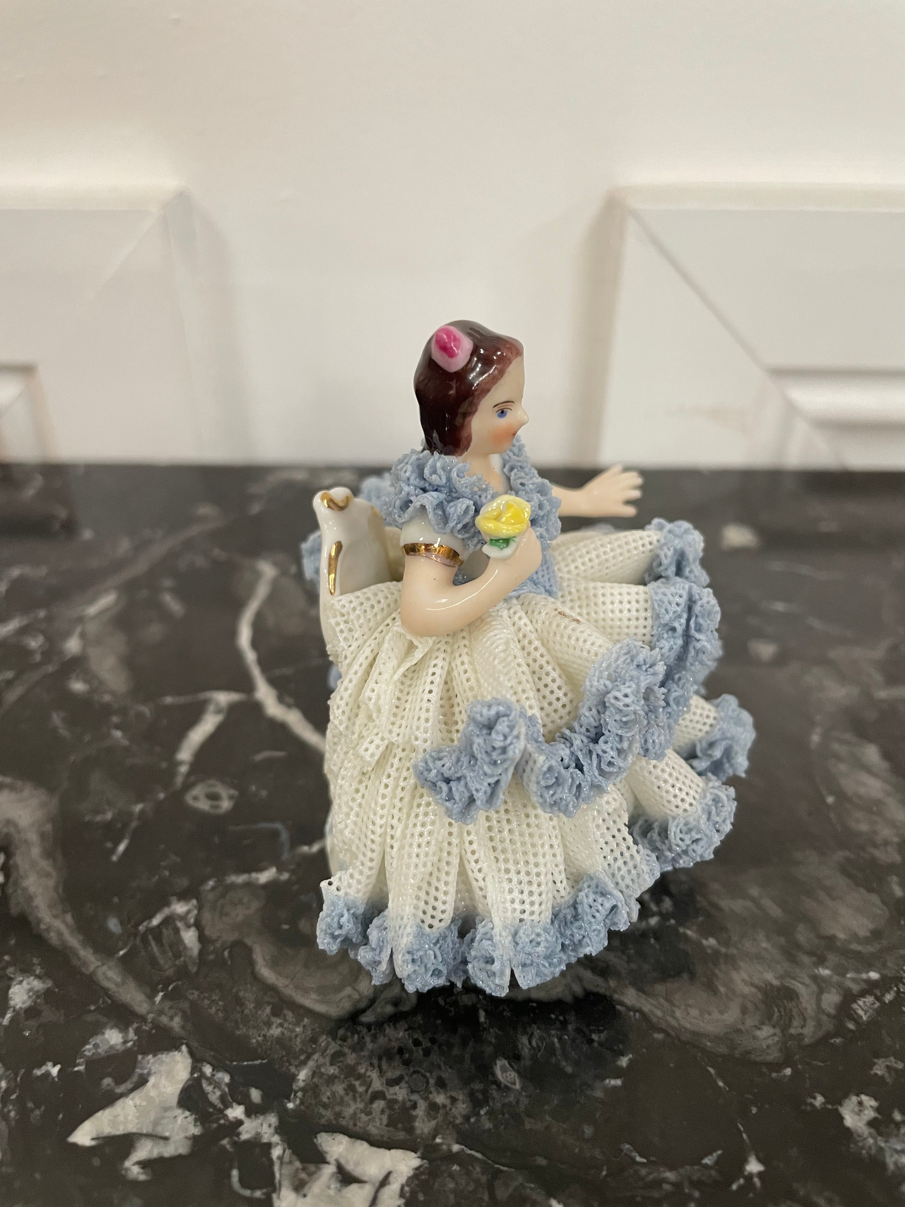 Dresden Lace Figurine of Lady Sitting Holding a Bird
