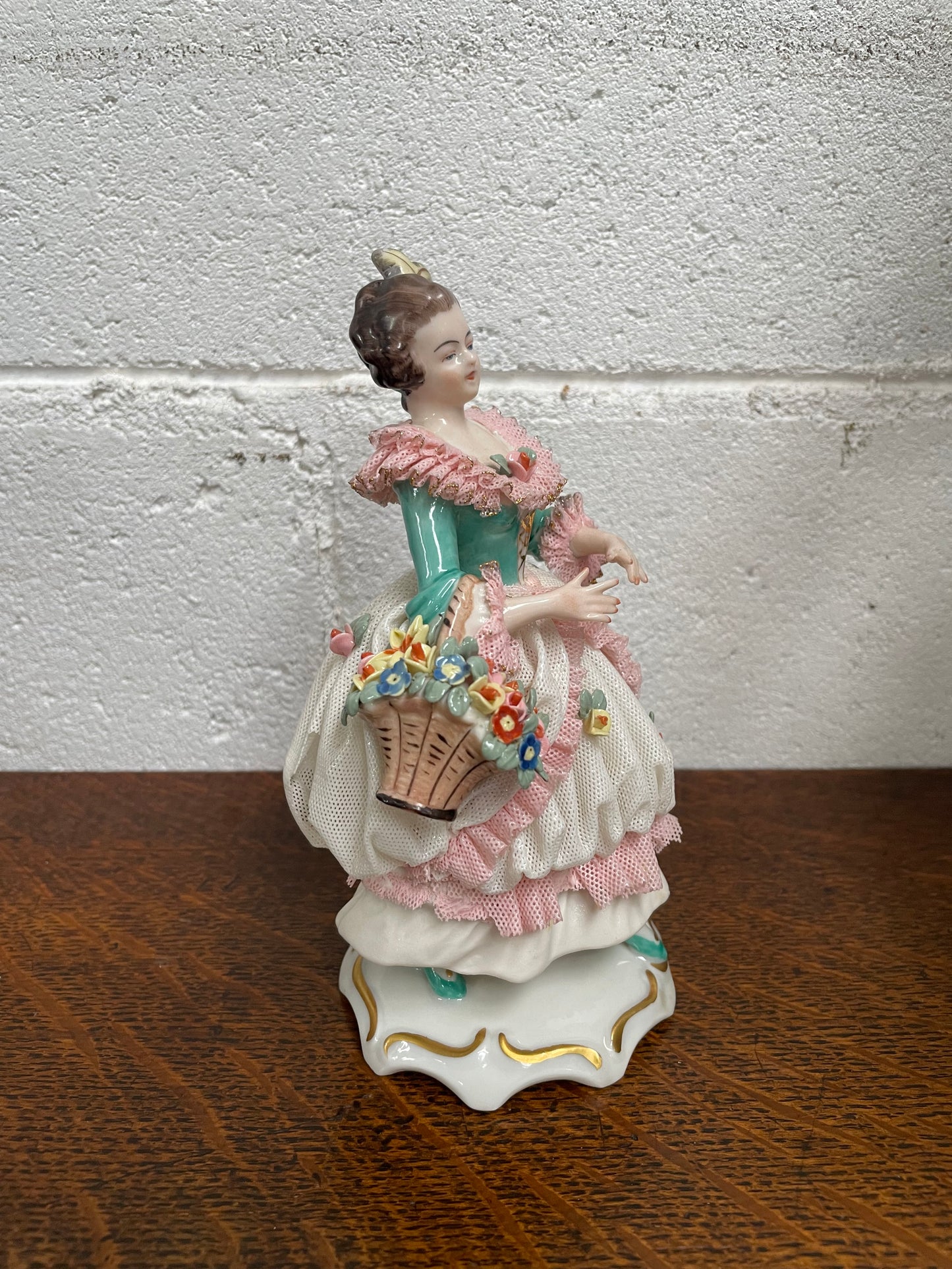 Dresden Figurine of Lady Holding Basket of Flowers