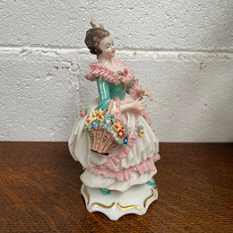 Dresden Figurine of Lady Holding Basket of Flowers