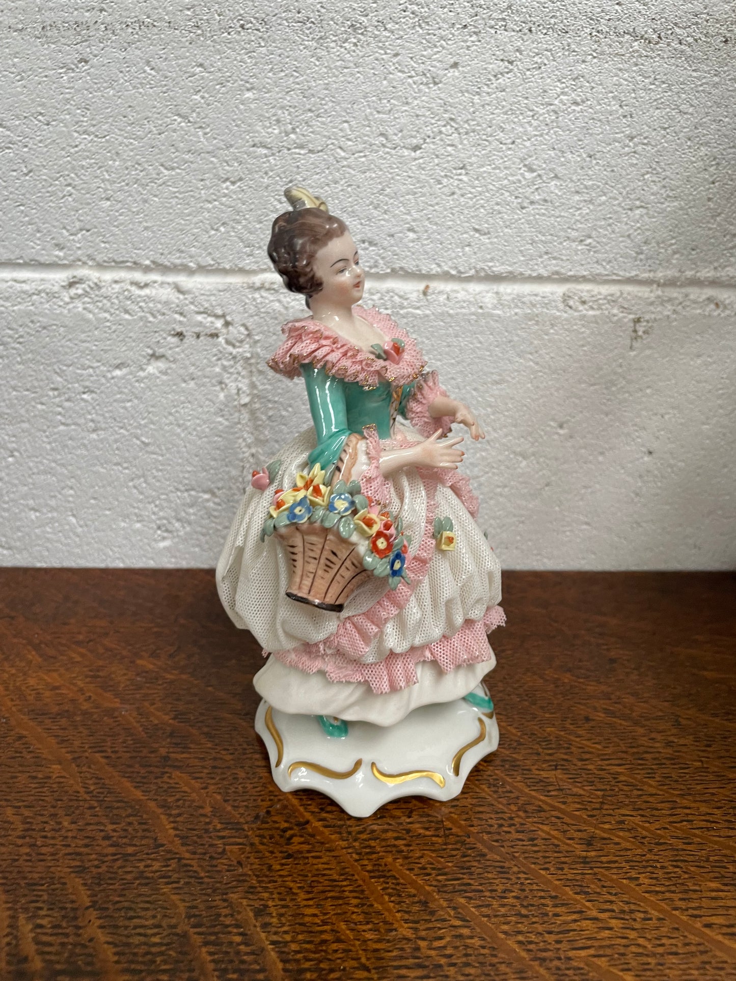 Dresden Figurine of Lady Holding Basket of Flowers