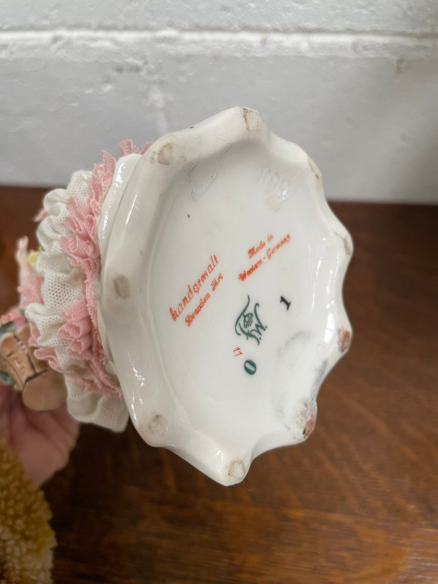 Dresden Figurine of Lady Holding Basket of Flowers