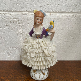 Dresden lace figurine stamped underneath and made in Germany. In good vintage condition with some slight damage to lace.