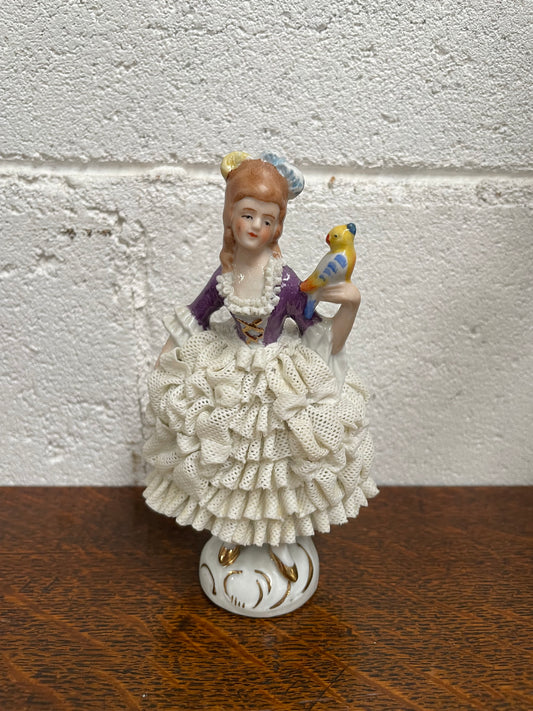 Dresden lace figurine stamped underneath and made in Germany. In good vintage condition with some slight damage to lace.