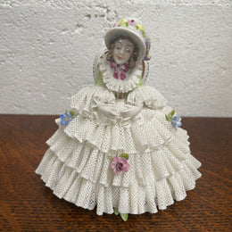 Dresden lace figurine stamped underneath and made in Germany. In good vintage condition with some slight damage to lace.