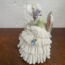 Dresden lace figurine stamped underneath and made in Germany. In good vintage condition with some slight damage to lace.