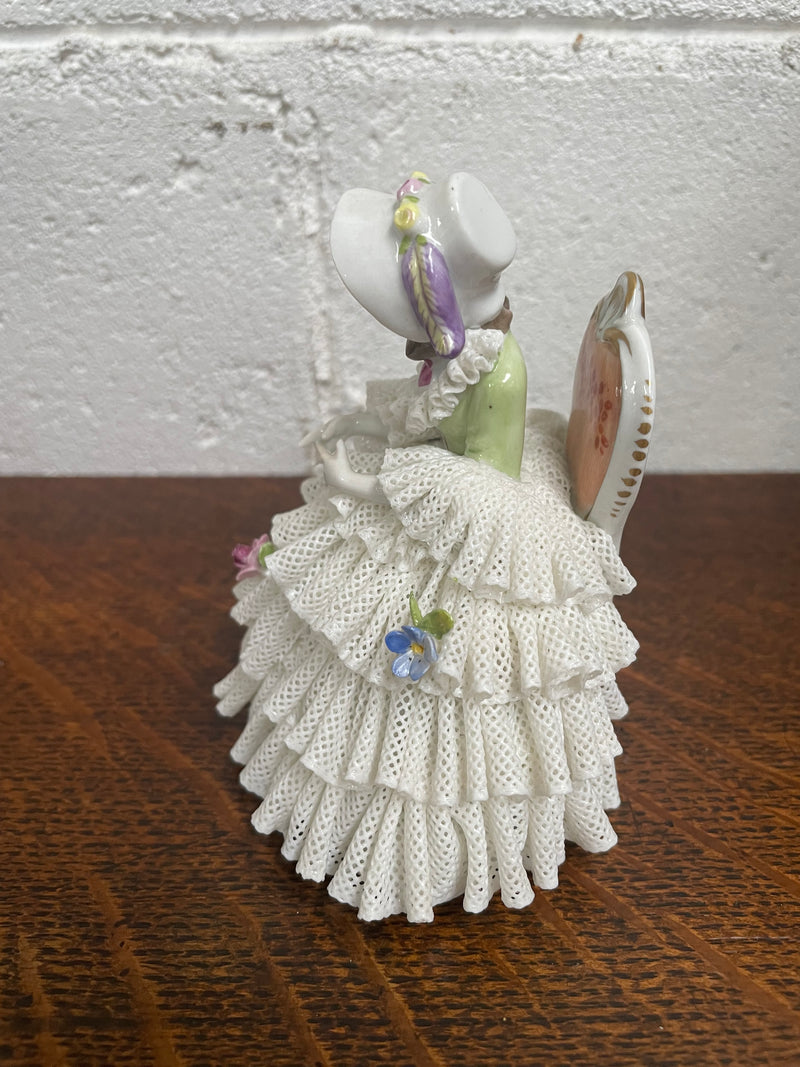 Dresden lace figurine stamped underneath and made in Germany. In good vintage condition with some slight damage to lace.